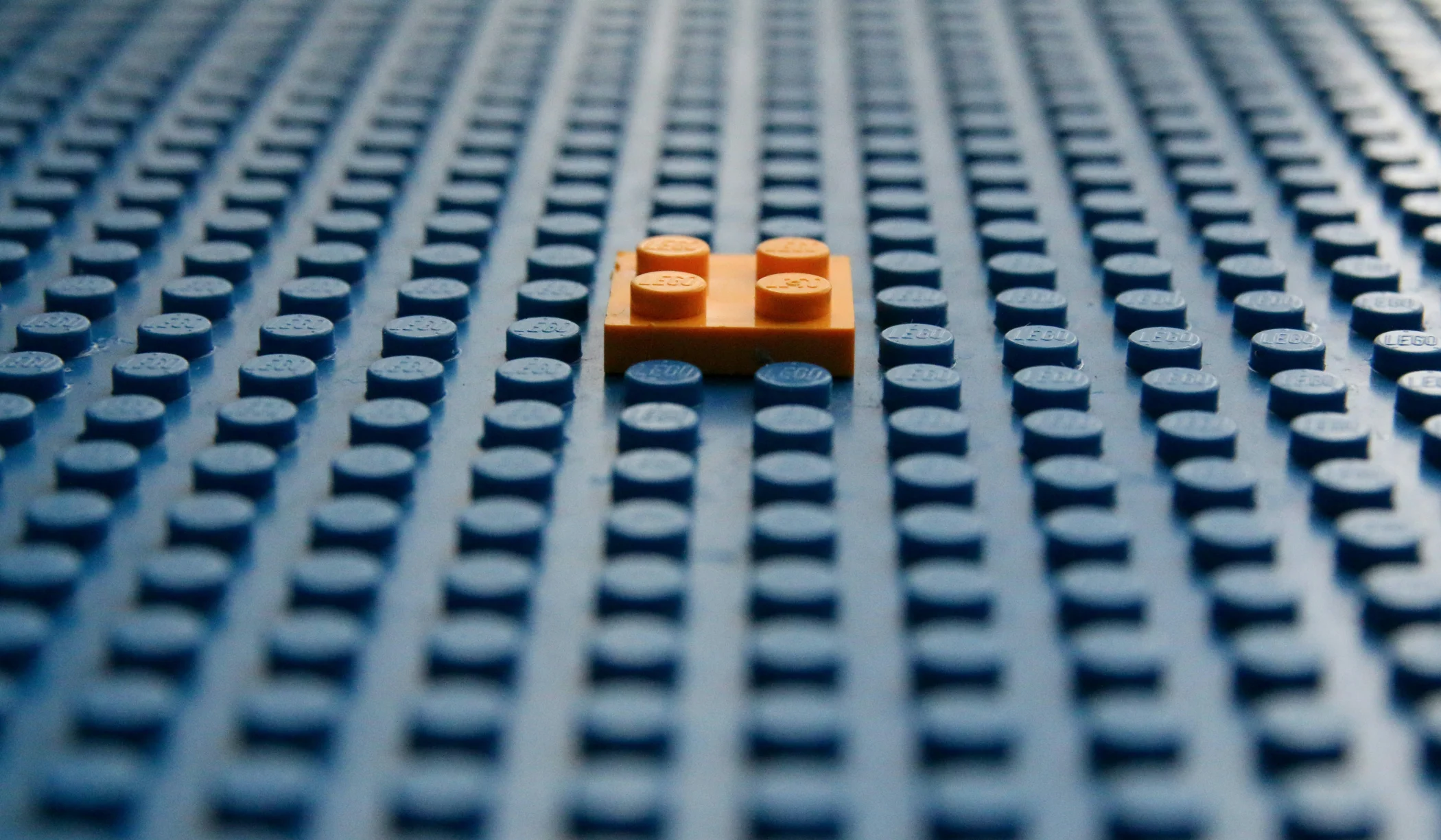 Single slim lego block on building board